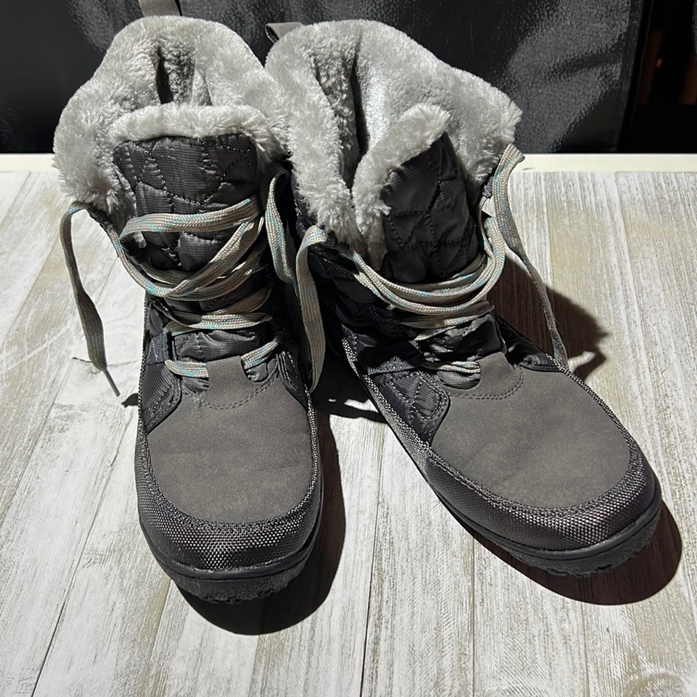 Woman’s grey winter boots